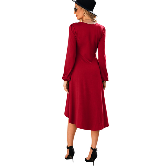 Woman wearing a red dress and black hat on a white background