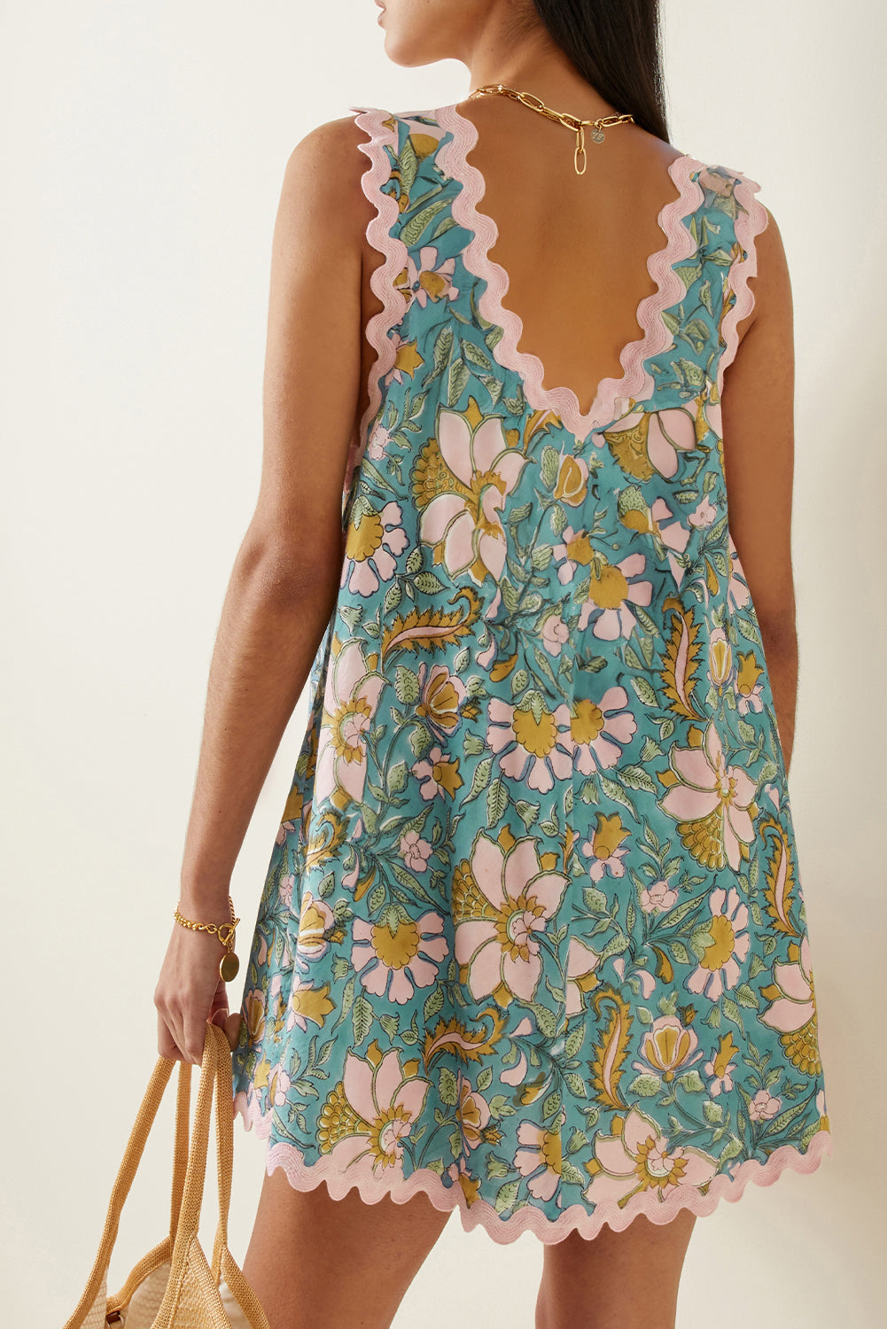 Sky blue allover floral mini dress for women. Back view.
