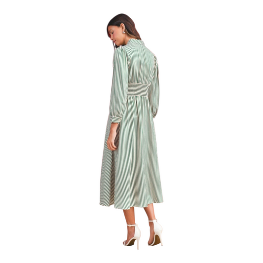 Woman wearing a green and white striped dress on a white background