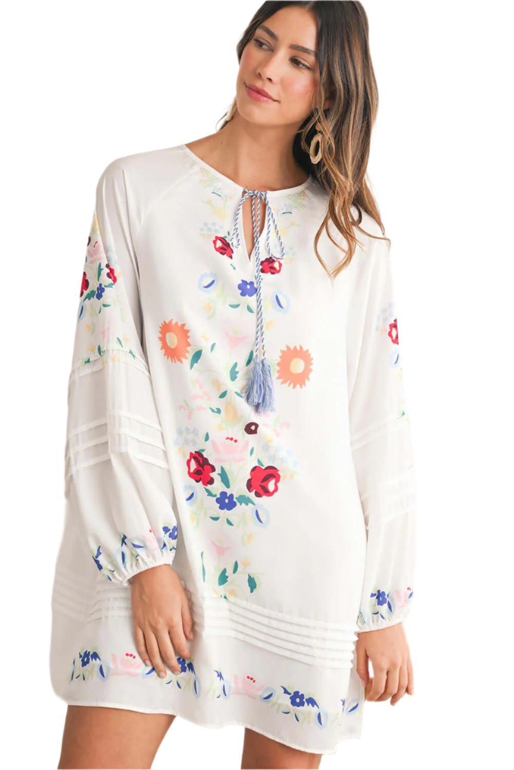 Women wearing a white floral embroidered boho mini dress with tassel tie neckline and flowy long sleeves - ideal for summer outings.