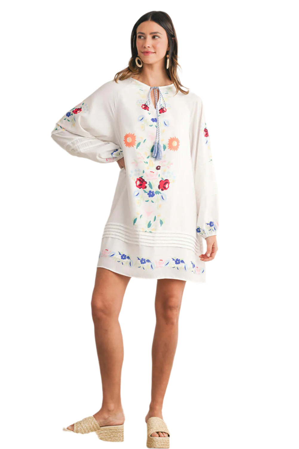 Full view of a white floral embroidered short dress with sleeves.
