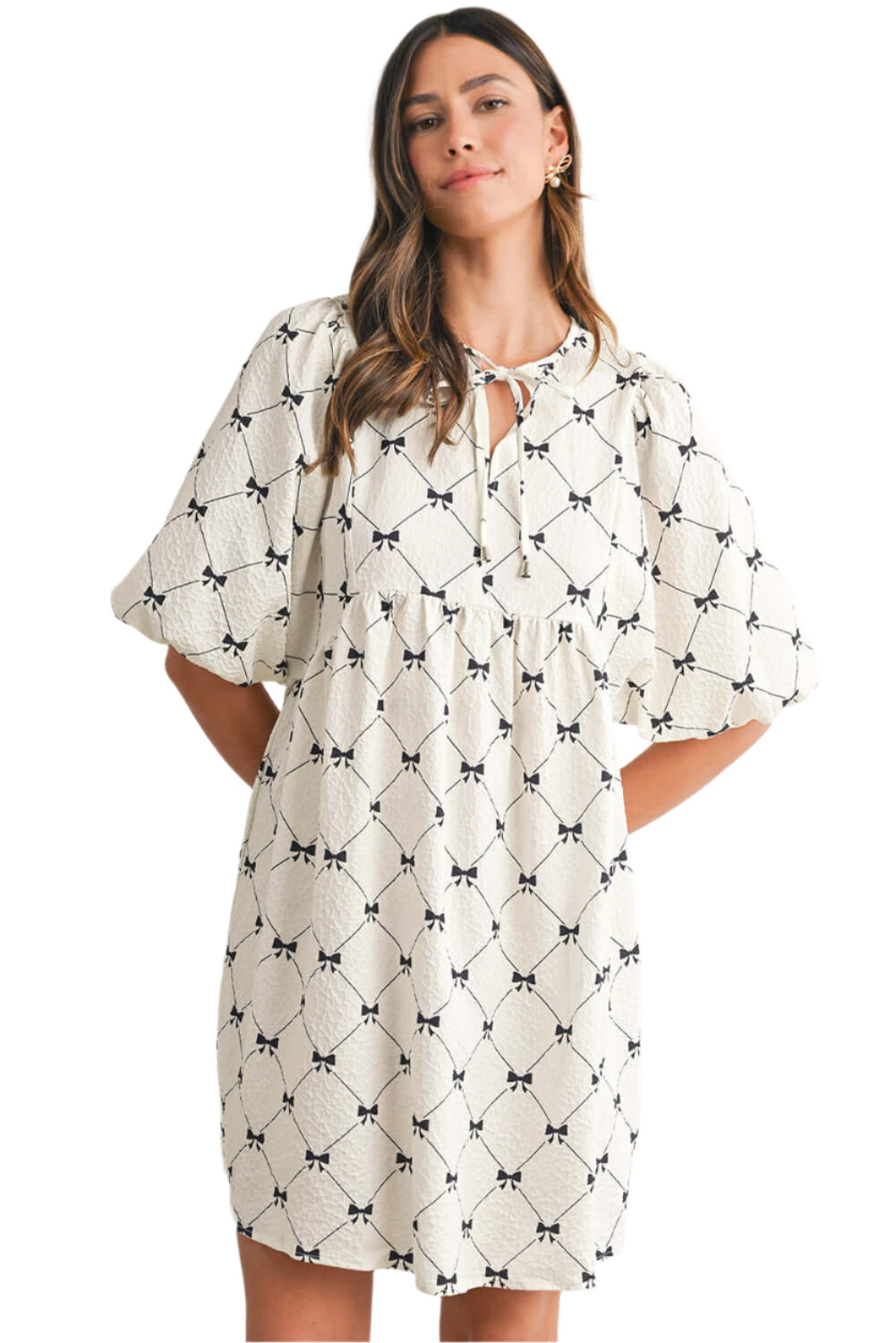 Woman wearing a white bow print with short lantern sleeves, perfect for summer casual party and other outings.