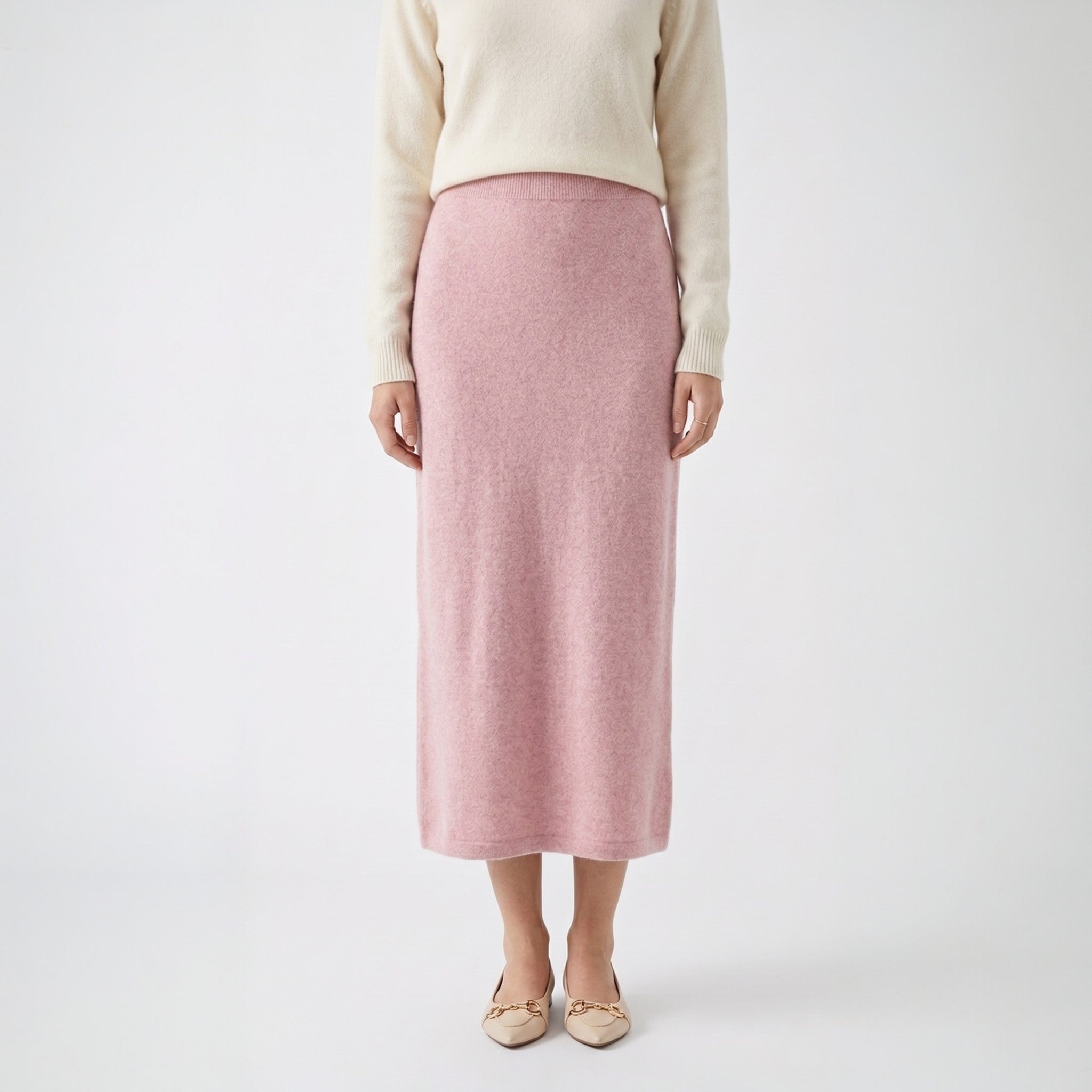 Flowy sheer beige embroidered maxi skirt with elastic waist, styled with a grey cardigan and brown boots.
