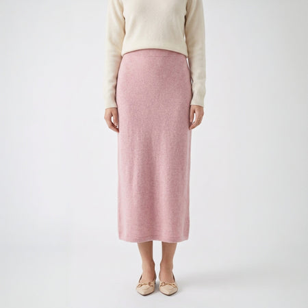 Flowy sheer beige embroidered maxi skirt with elastic waist, styled with a grey cardigan and brown boots.