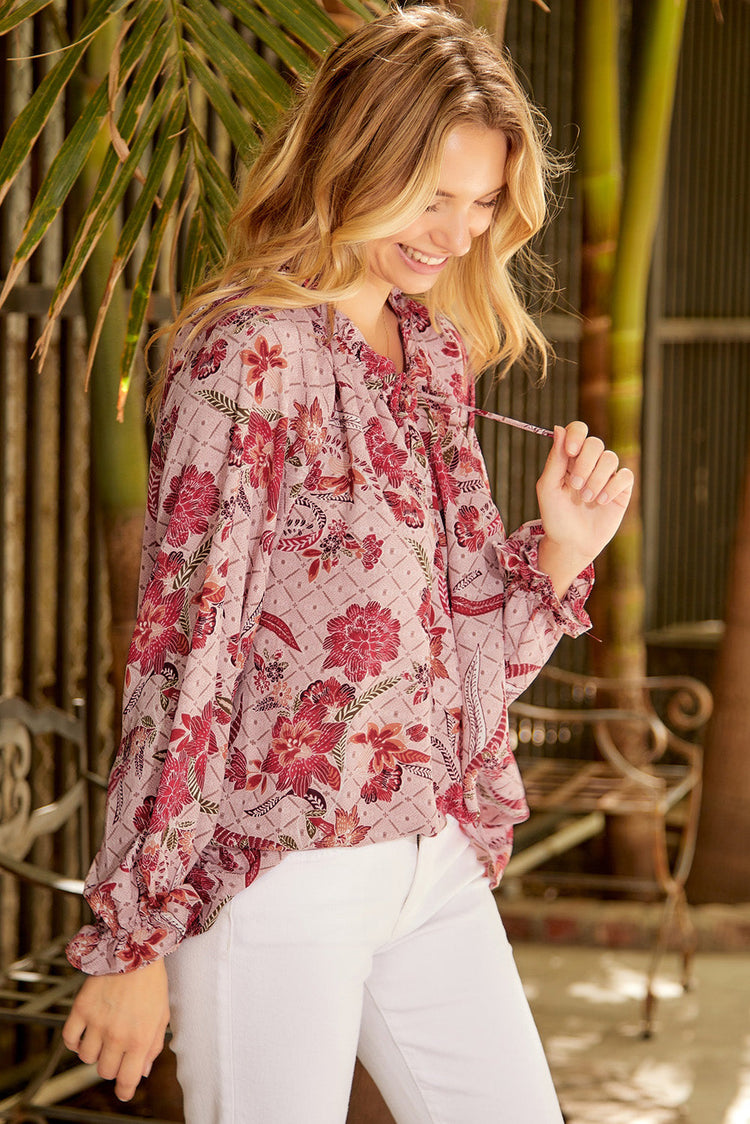 Pink floral peasant blouse with long sleeves, perfect for spring and summer casual wear – front view., 