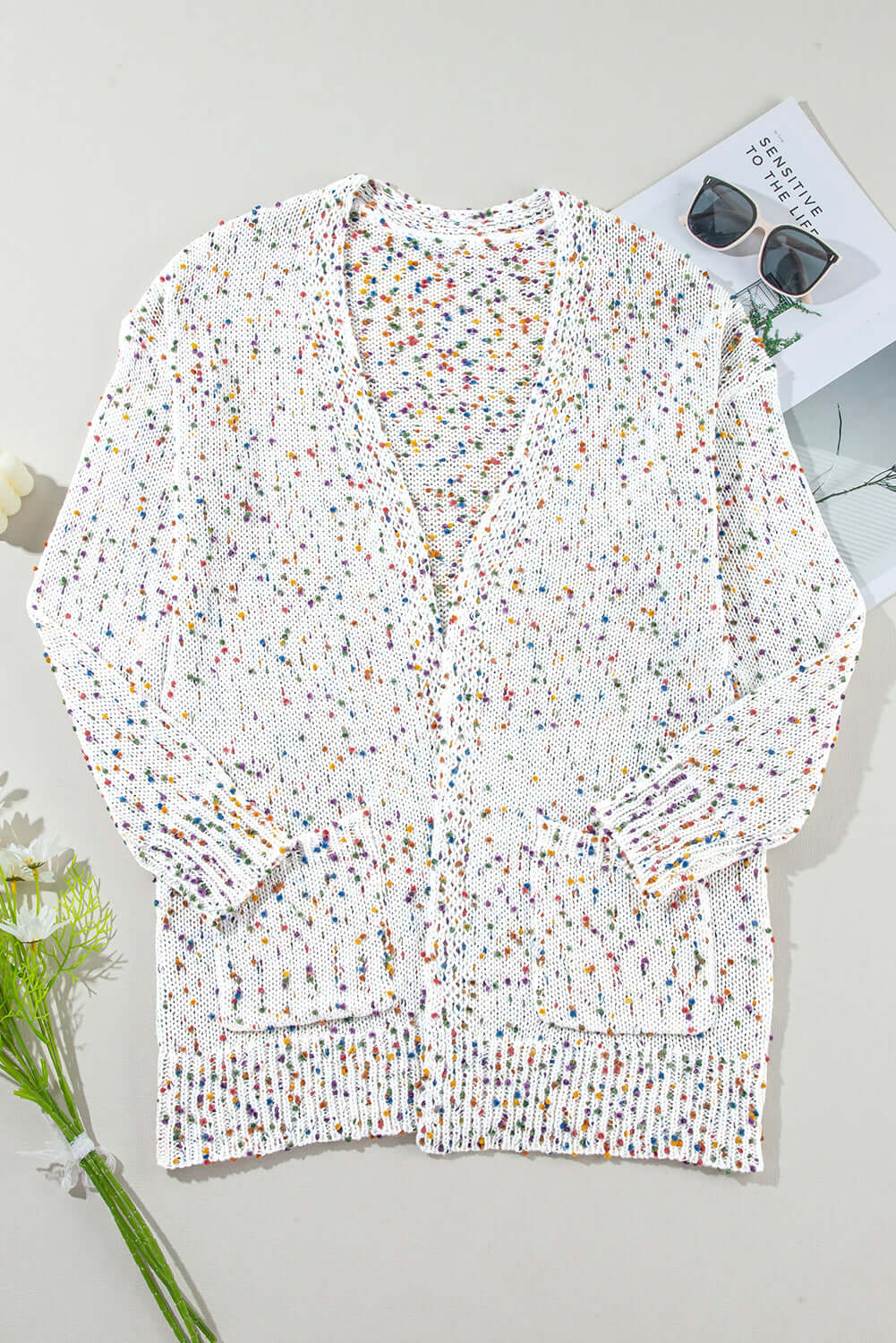 Stylish white dot cardigan perfect for layering in any season.