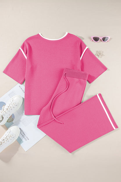 Pink outfit with shorts on a light brown background