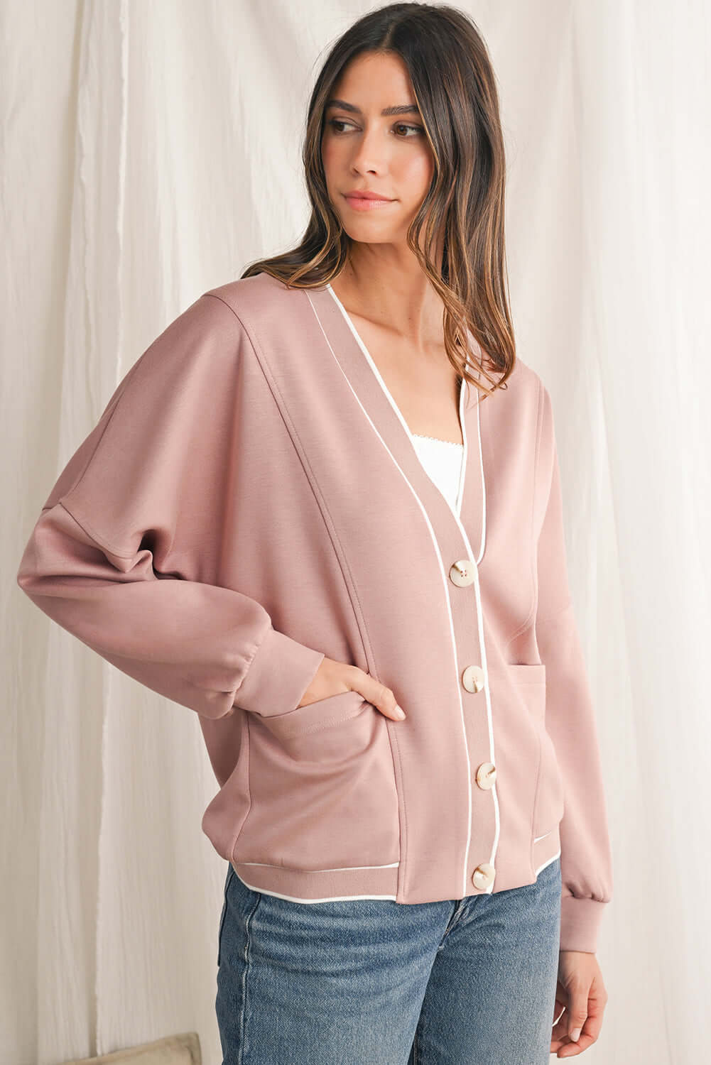 Button-down pink striped cardigan for easy layering.