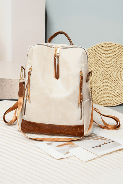 Stylish white faux leather backpack with a sleek and minimalist design