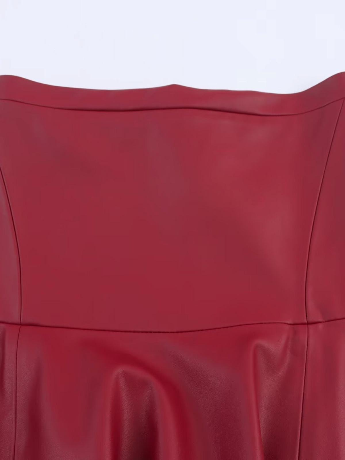 Catherine Martin burgundy faux leather midi skirt featuring a high waist and curved yoke seaming detail.
