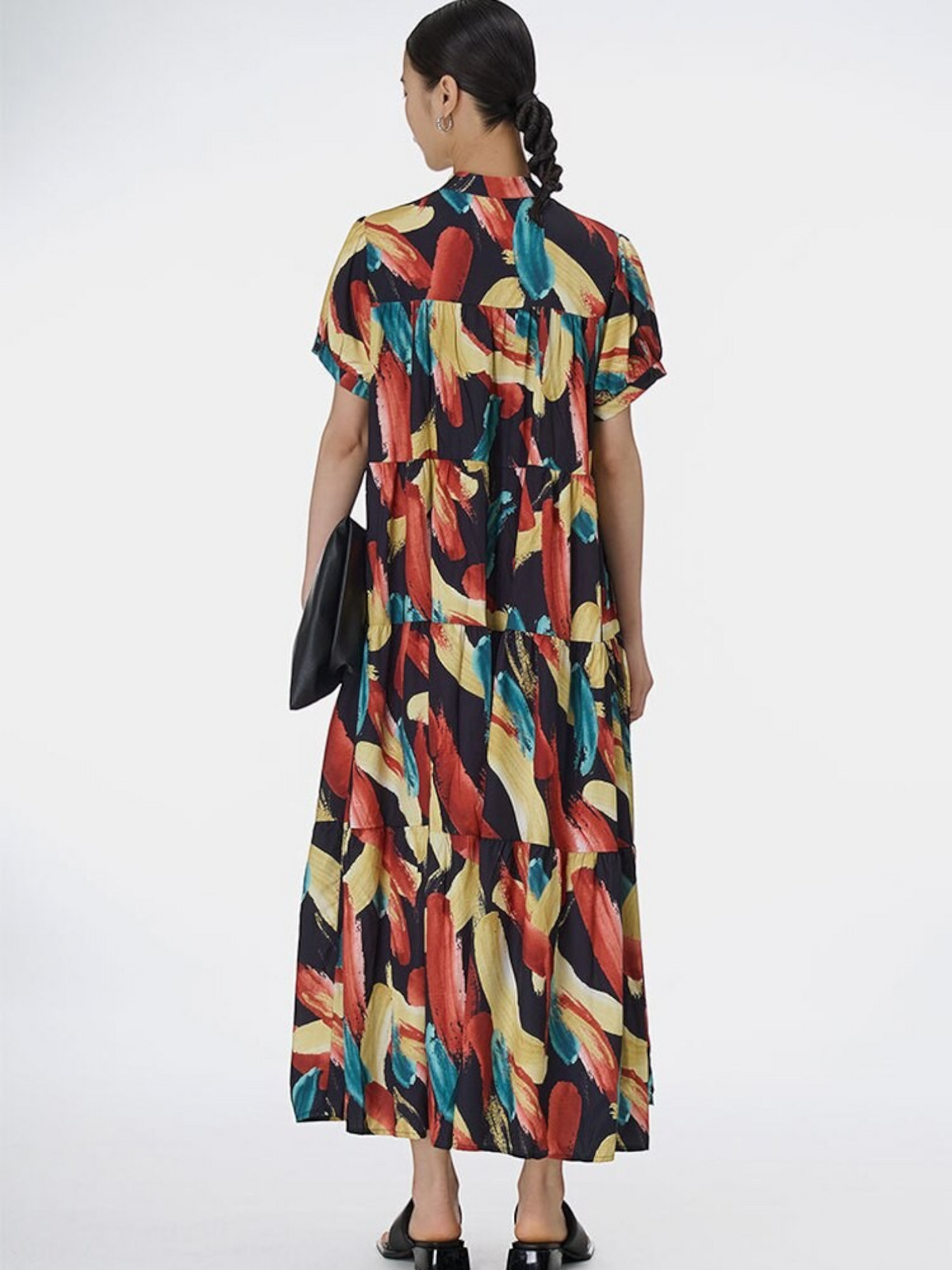 Catherine Martin midi dress with multicolour abstract brushstroke print, tiered pleated skirt, and short sleeves.
