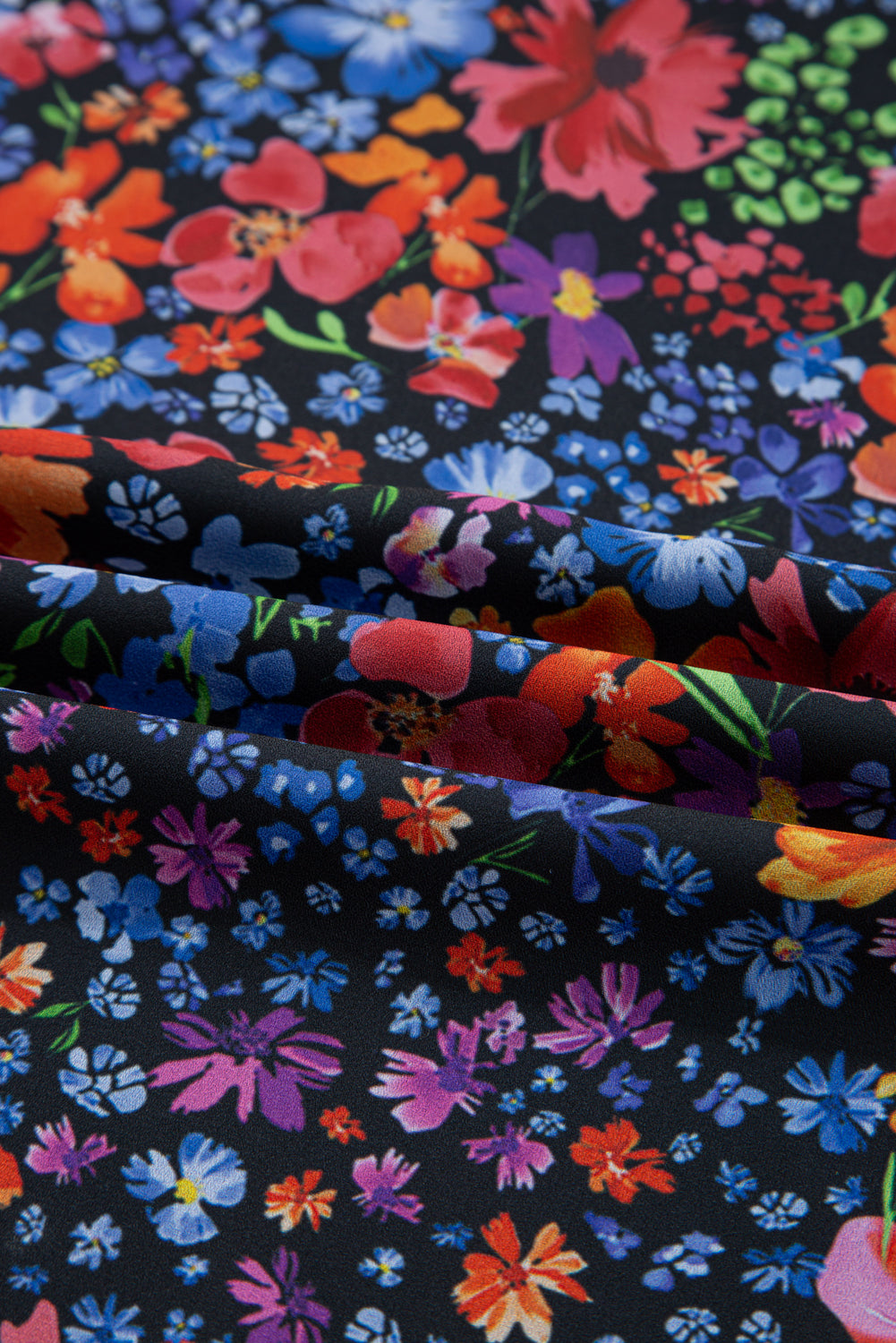 Colorful floral pattern on black fabric