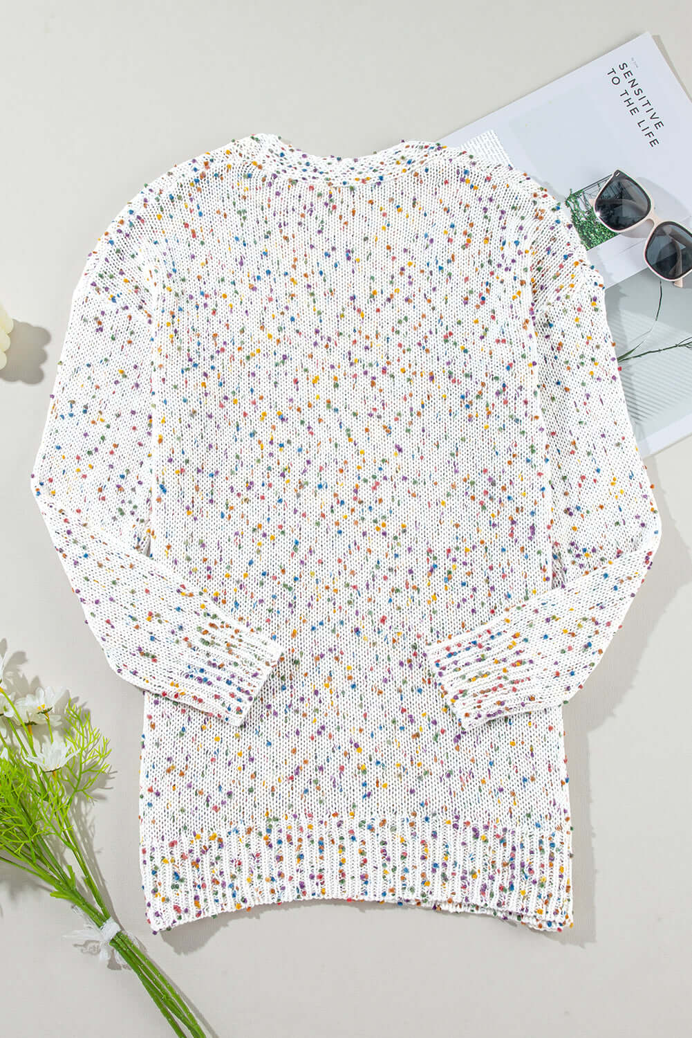 Stylish white dot cardigan perfect for layering in any season.
