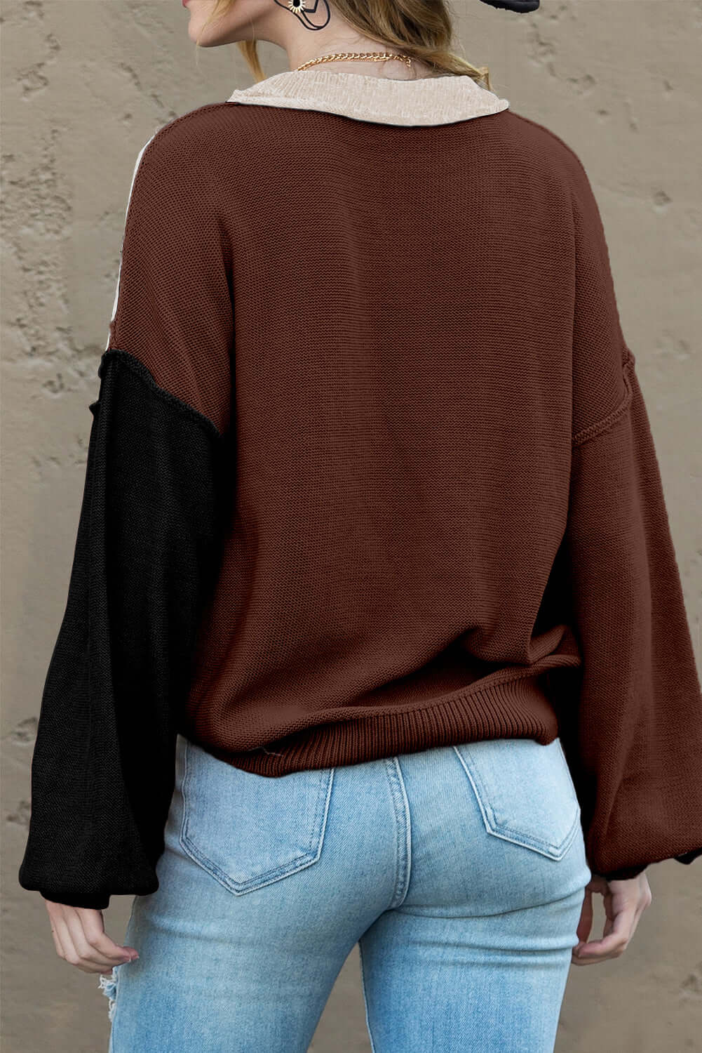 Back view of a soft knit jumper with elegant bishop sleeves in autumn hues
