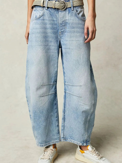 Catherine Martin light wash barrel leg denim jeans with knee seaming and cropped hem worn with sneakers