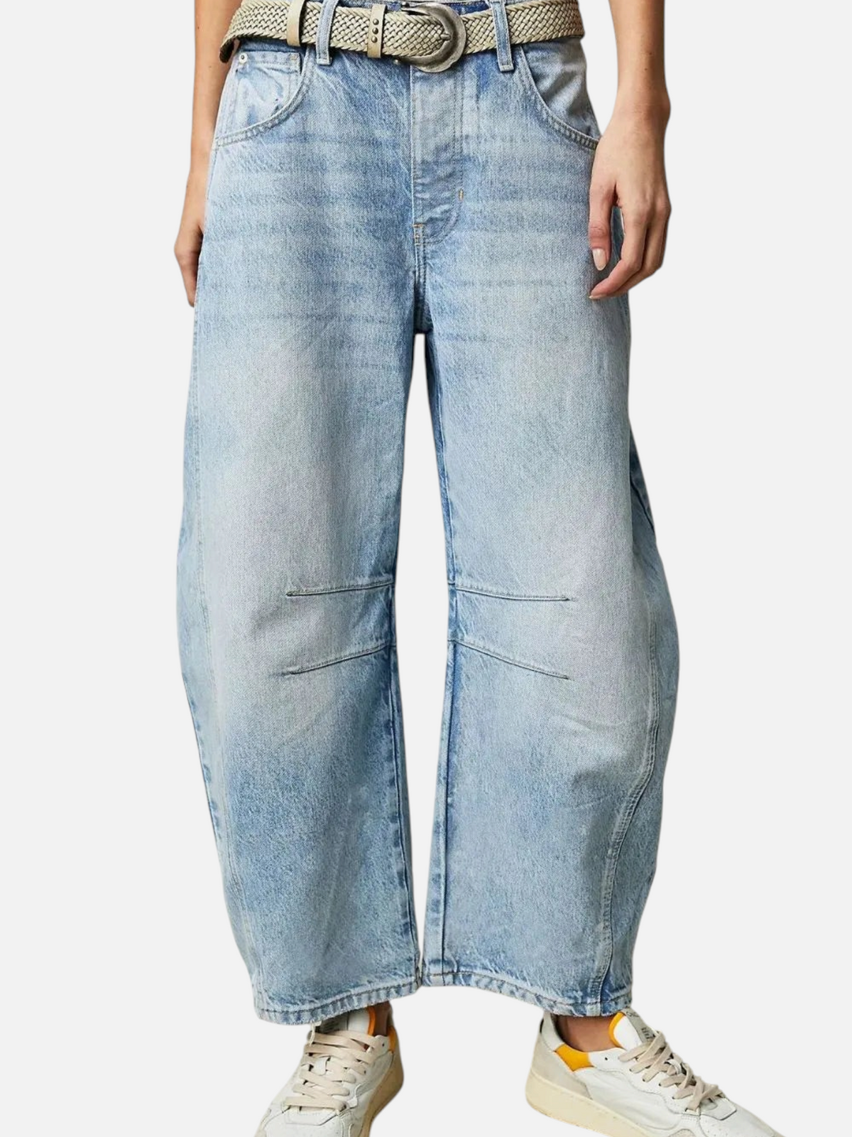 Catherine Martin light wash barrel leg jeans in rigid denim with knee seaming and cropped hem on a model