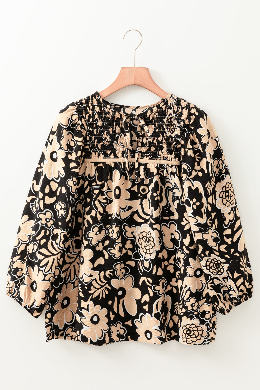 Front view of a black floral boho blouse with half sleeves, available at Catherine Martin Store, Australia.