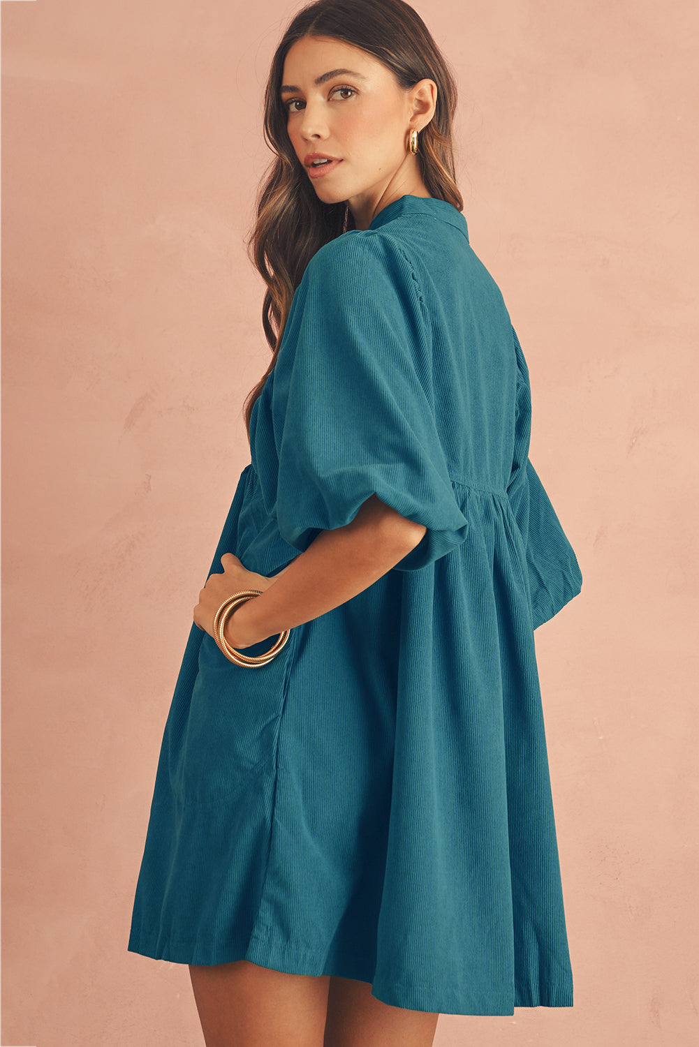 The side view of blue babydoll dress , featuring short lantern sleeves, perfect choice for party and casual social events.