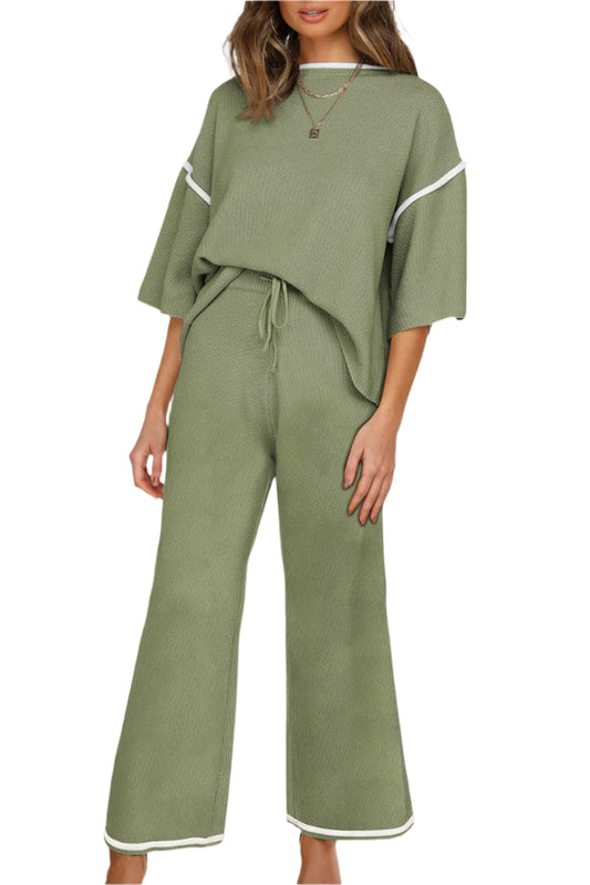 Green outfit with white trim on a white background
