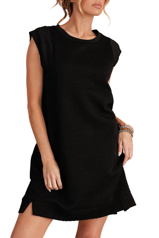 Woman wearing a black dress against a white background