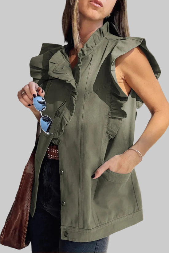 Woman wearing a green sleeveless jacket with sunglasses and a brown bag.