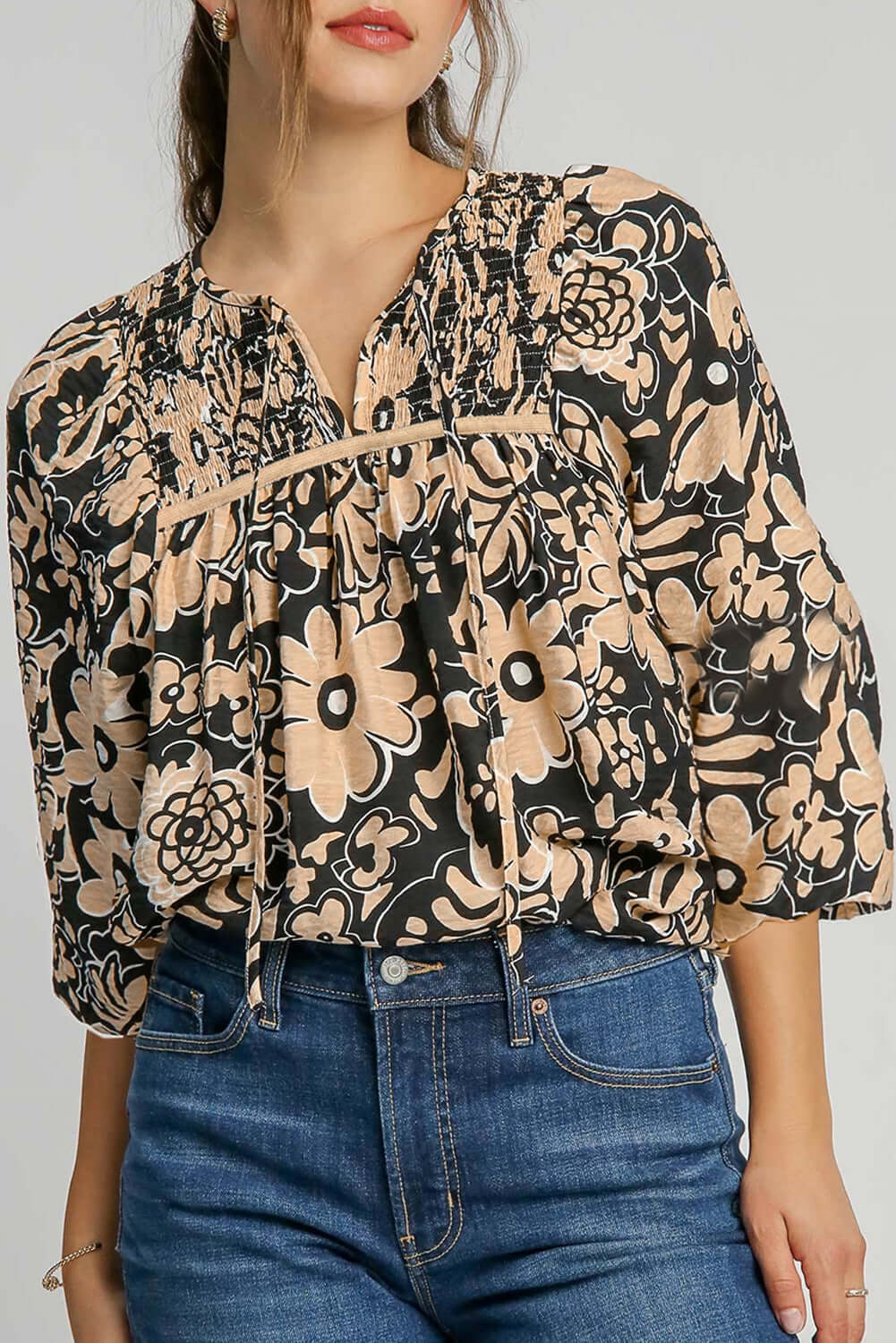 Front view of a black floral boho blouse with half sleeves, styled on a standing model, perfect for autumn and summer seasons.