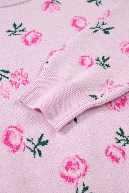 Close-up of a pink sweater with floral patterns