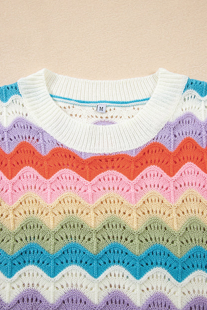 Colorful knitted sweater with a pattern on a beige background