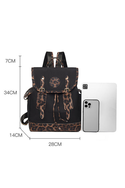 Black backpack with leopard print details and dimensions shown on a white background