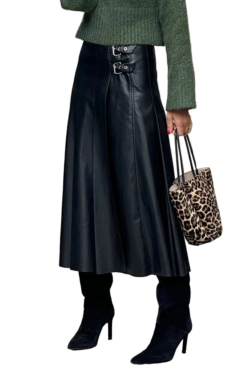 Person wearing a green sweater, black leather skirt, and black high-heeled boots, holding a leopard print bag.