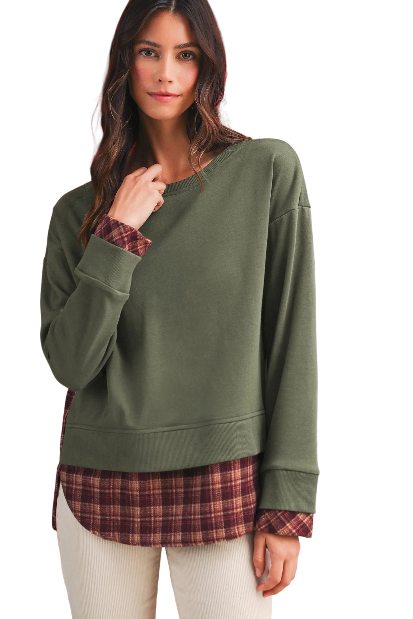 Model wearing the relaxed olive sweatshirt with layered plaid cuffs peeking out from the ribbed sleeves.