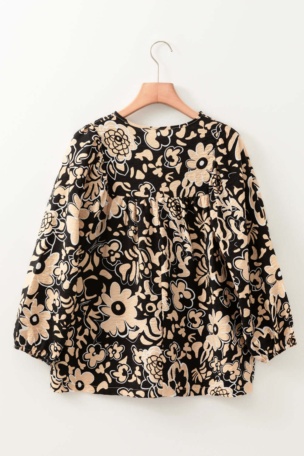 Back view of a black floral boho blouse with half sleeves, available at Catherine Martin Store, Australia.