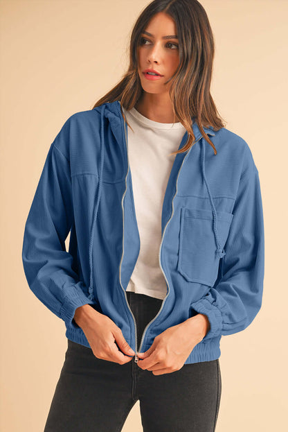 Front view of Women's Aussie Chill Blue Hoodie – cozy corduroy with zip-up front and drawstring hood.