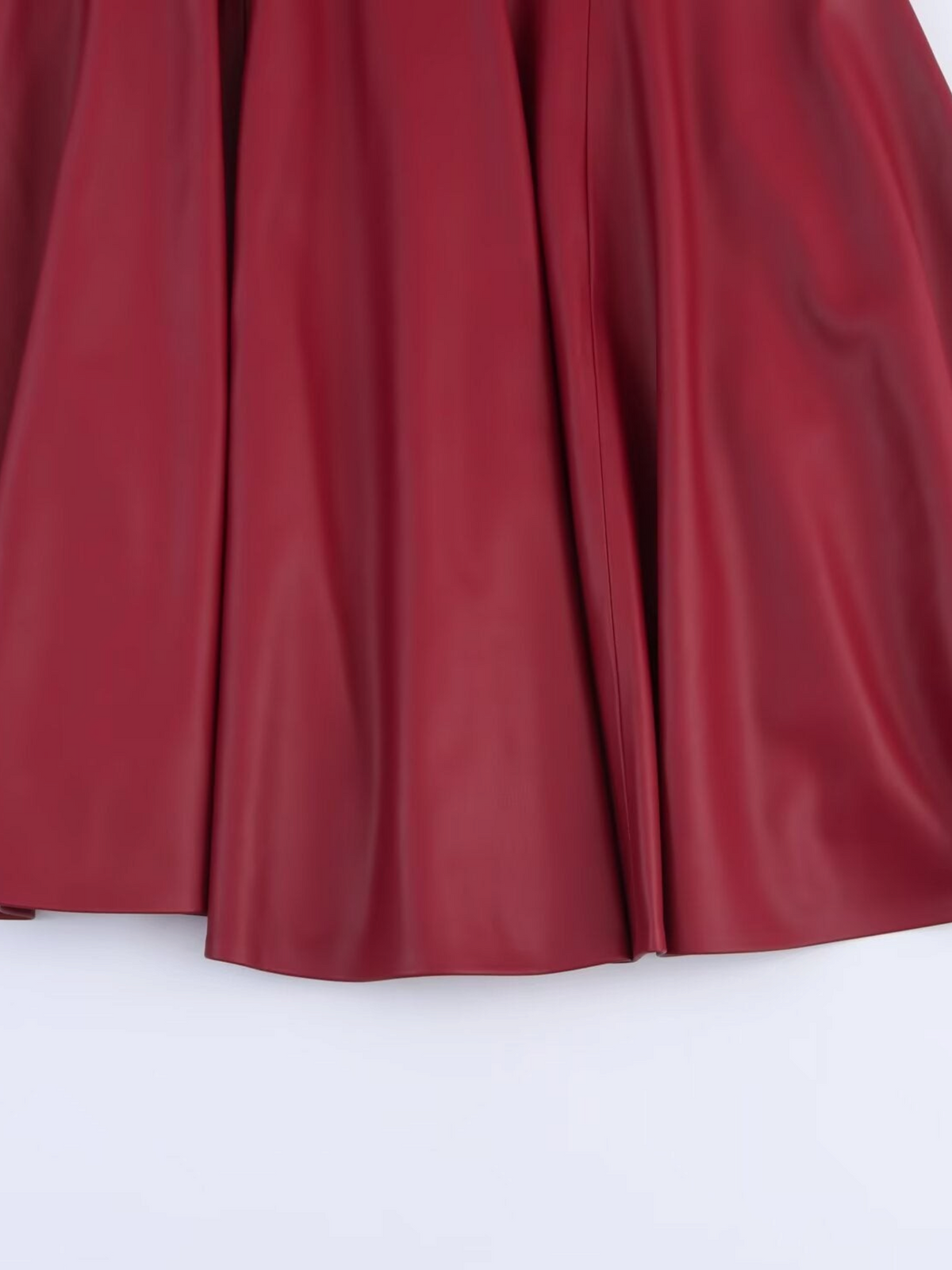Catherine Martin burgundy midi skirt in soft faux leather with a flared A-line silhouette and subtle sheen.
