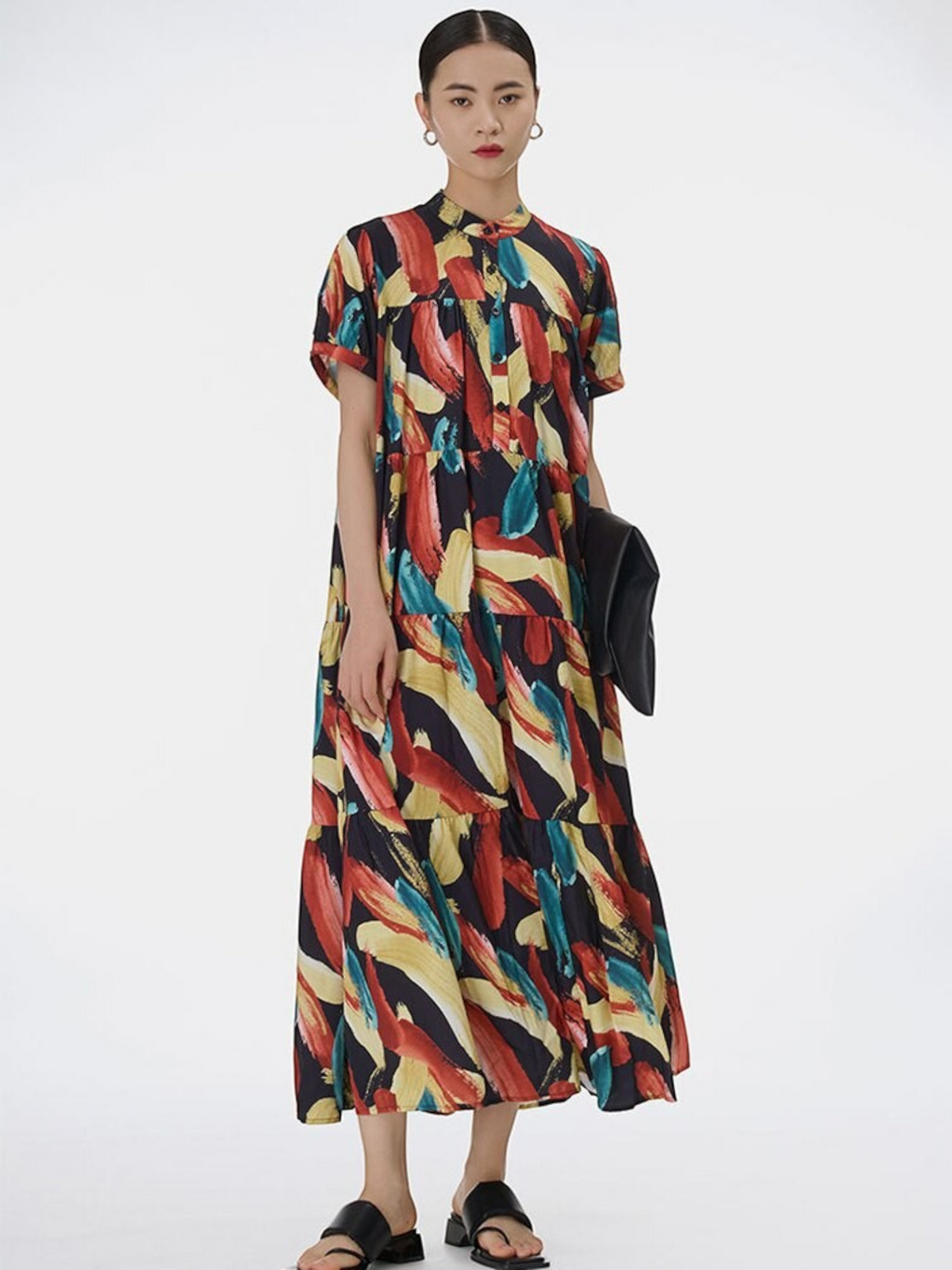 Catherine Martin midi dress featuring a multicolour abstract brushstroke print, stand collar, and tiered pleated skirt.