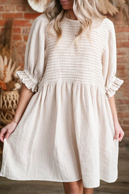 Cute Neutral Tone Loose Dress with Sleeves. Front view, focus.