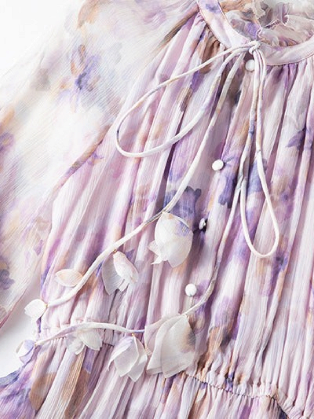 Catherine Martin lilac floral silk chiffon dress with ruffled stand collar, tie neck, and delicate petal trims.