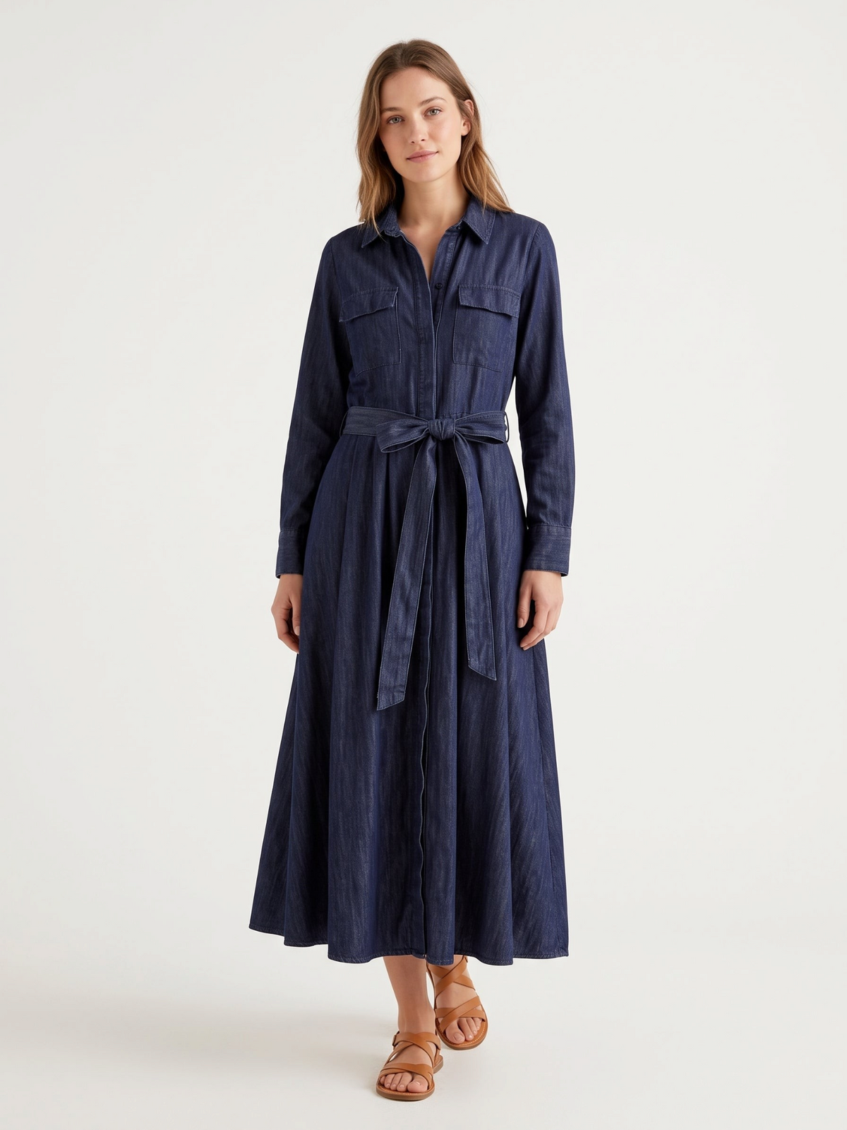 Catherine Martin dark indigo denim shirt dress with a belted waist, long sleeves, and A-line maxi skirt.