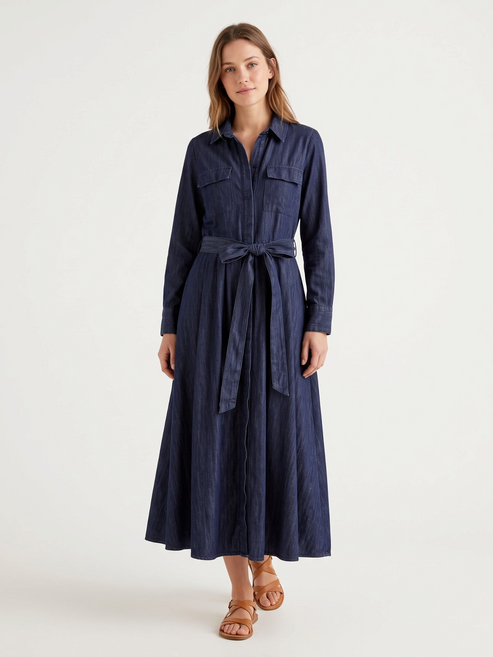 Catherine Martin dark indigo denim shirt dress with a belted waist, long sleeves, and A-line maxi skirt.