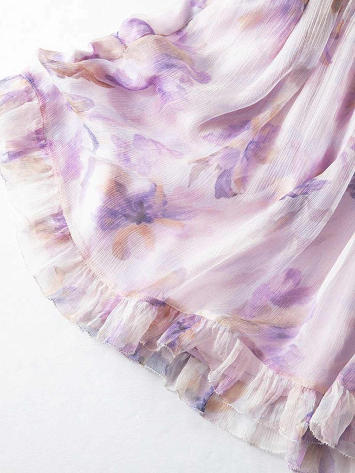Catherine Martin lilac floral silk chiffon dress featuring a delicate watercolour print and a ruffled hem detail.