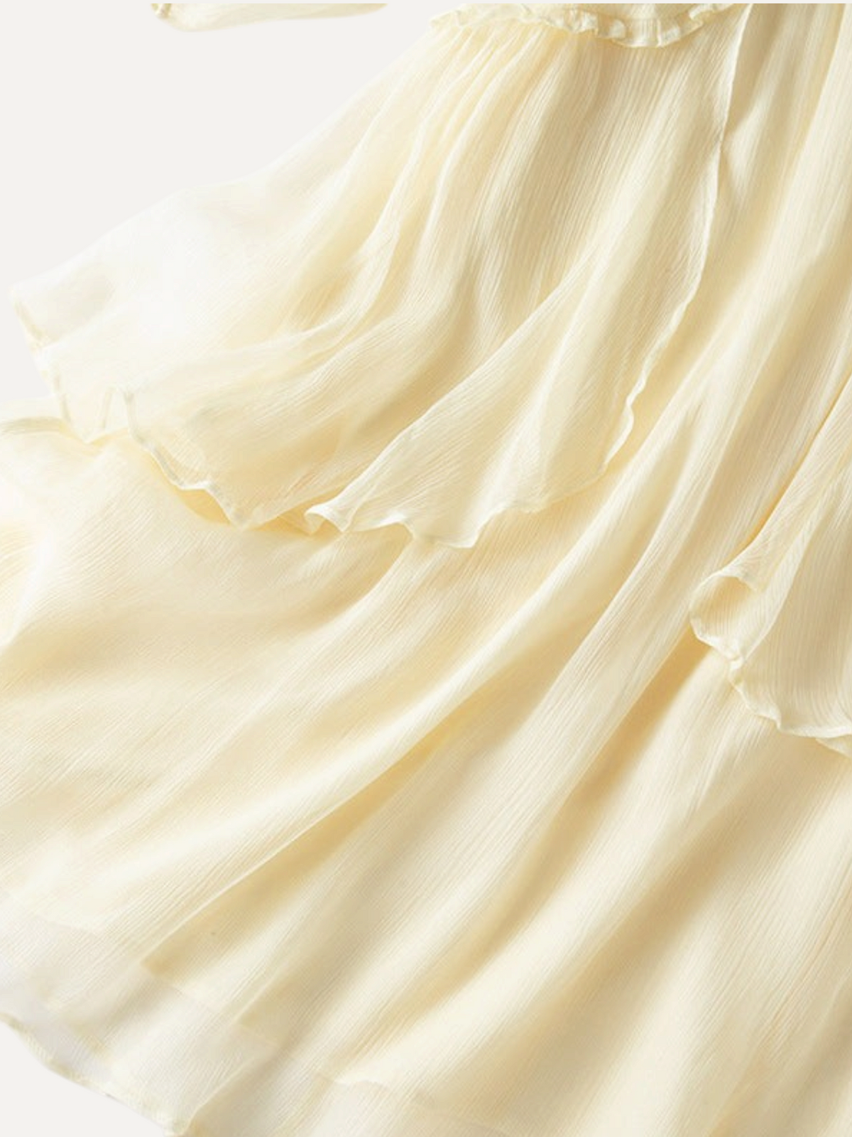 Catherine Martin light yellow mulberry silk maxi dress featuring a tiered skirt with delicate ruffle trim details.