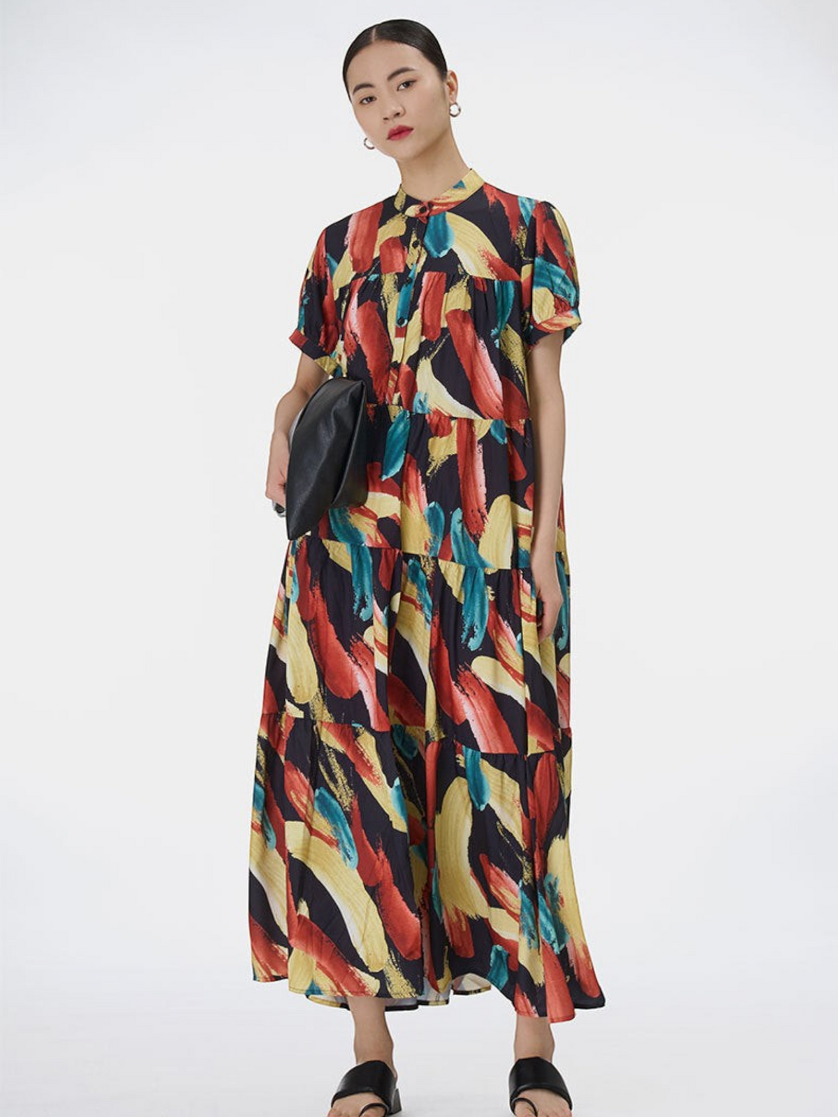 Catherine Martin midi dress with multicolour abstract brushstroke print, stand collar, and tiered pleated skirt.