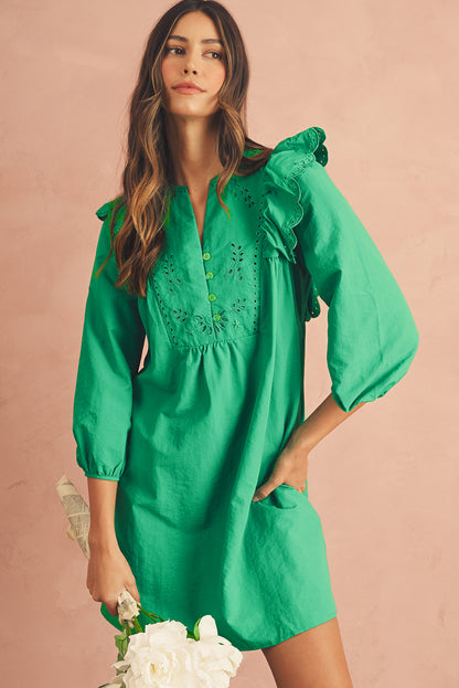 The front view of green embroidered mini dress. It features with frill shoulders and 3/4 sleeves.