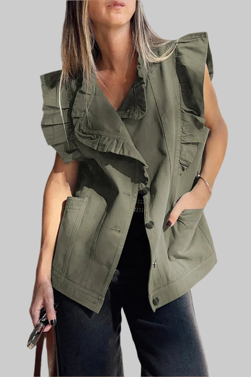 Woman wearing a green vest against a neutral background