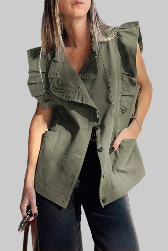 Woman wearing a green vest against a neutral background