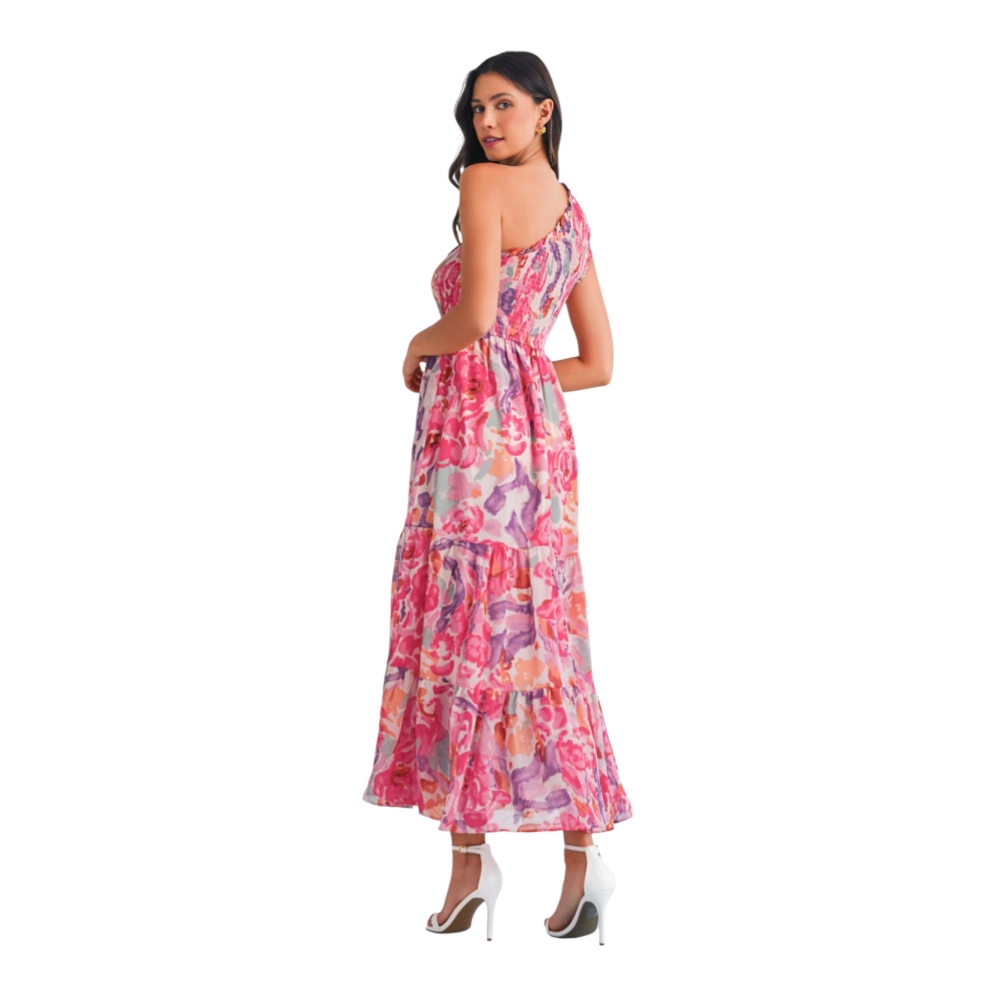 Rear view of a one-shoulder abstract floral maxi dress showing the smocked back panel and a graceful tiered skirt.