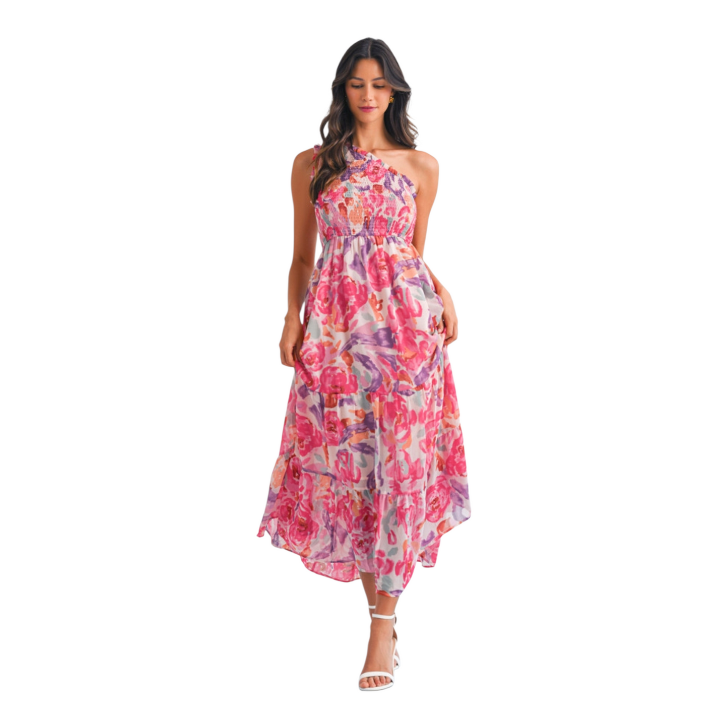 A woman wearing a pink and lilac abstract floral maxi dress featuring a sophisticated one-shoulder neckline and a textured smocked bodice.