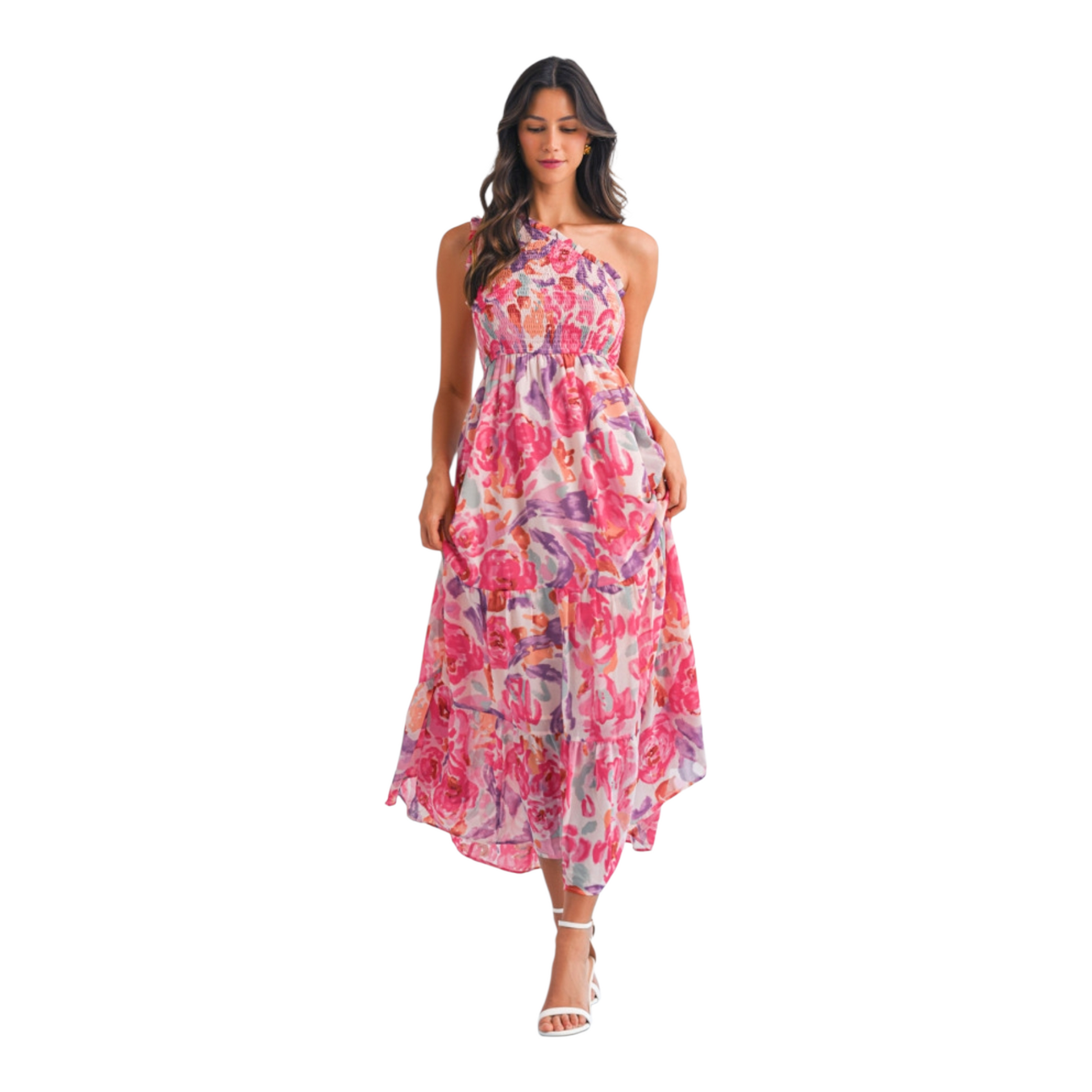 A woman wearing a pink and lilac abstract floral maxi dress featuring a sophisticated one-shoulder neckline and a textured smocked bodice.