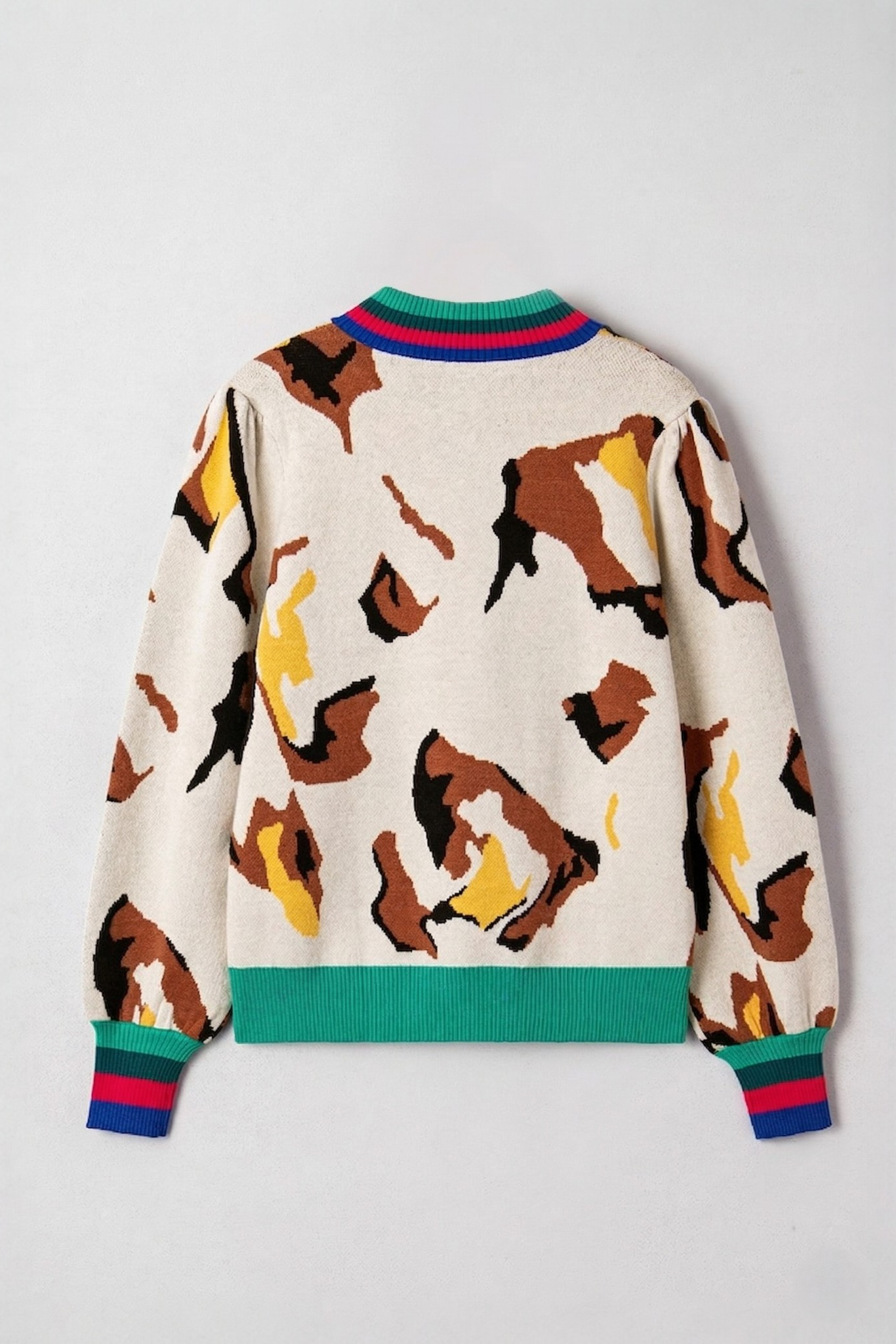 Abstract print stripe trim knit sweater flat lay back view showing multicolour striped collar cuffs and hem detail