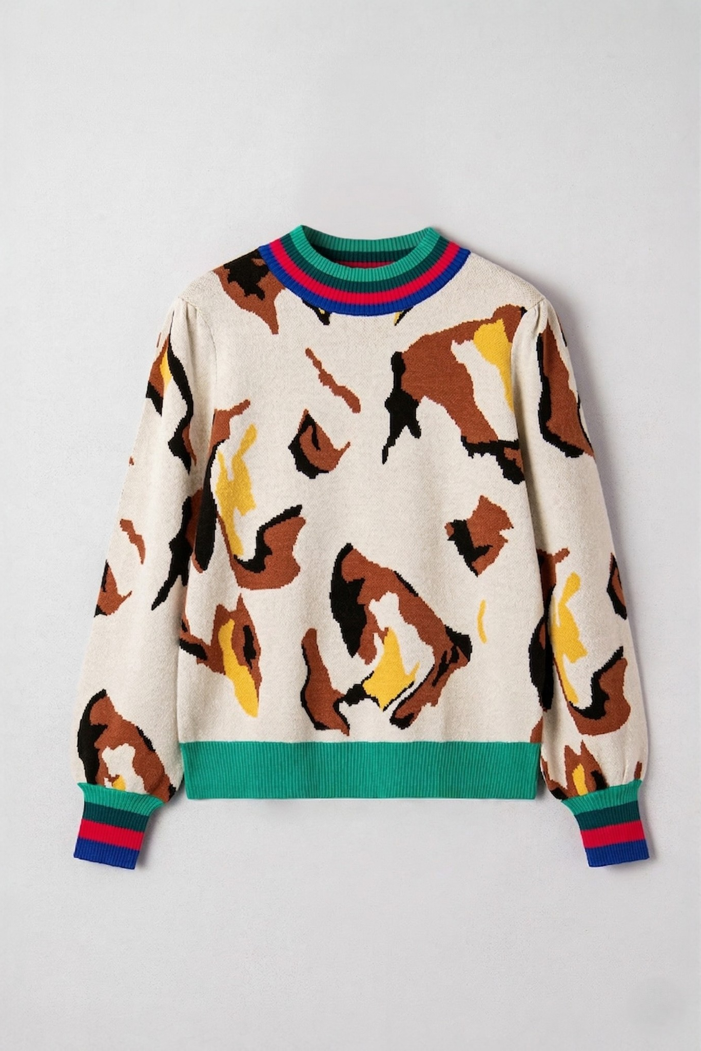 Abstract print stripe trim knit sweater flat lay front view showing abstract intarsia knit print and multicolour striped trim